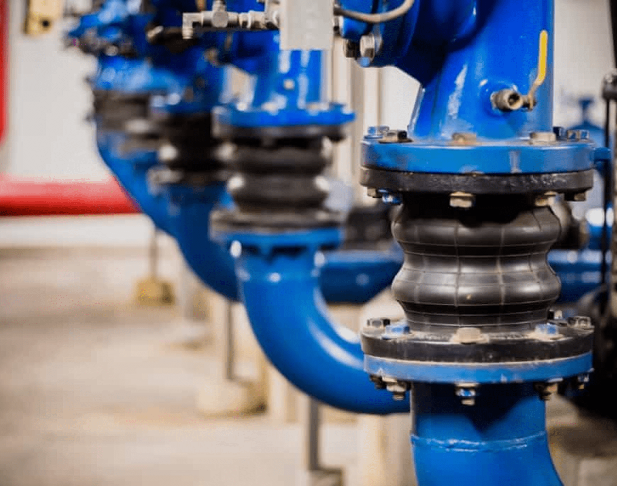 Blue industrial pipes with rubber joints.