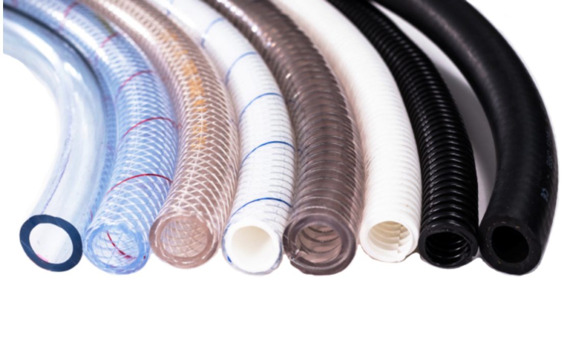 Various colored industrial hoses in a row.