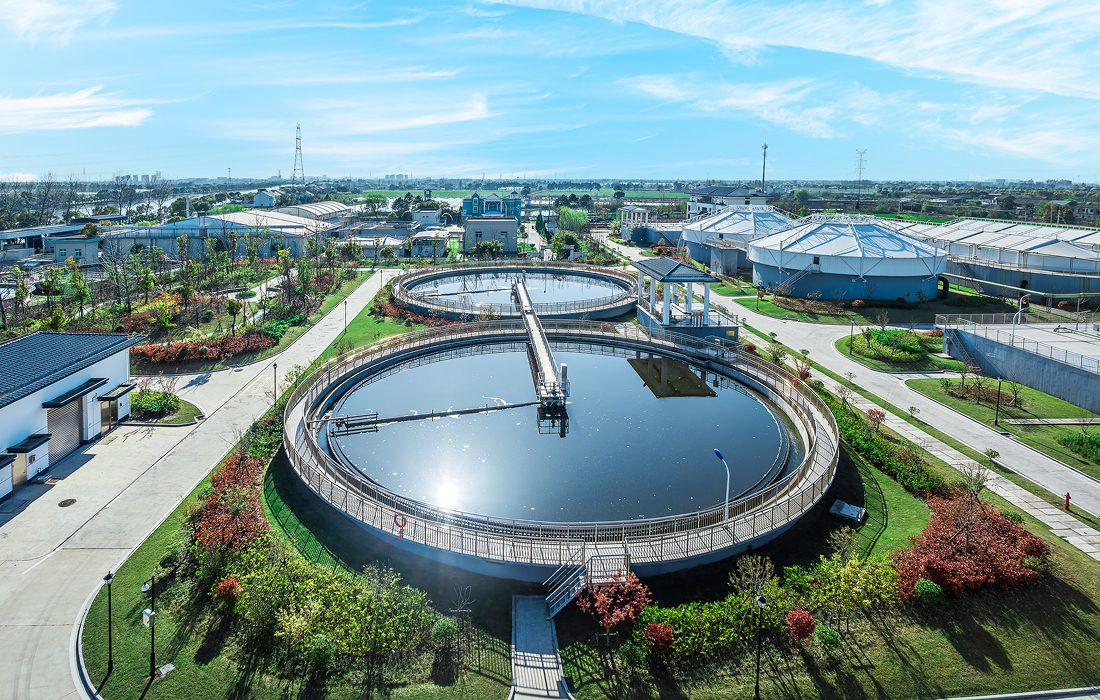 Water treatment plant with circular tanks.
